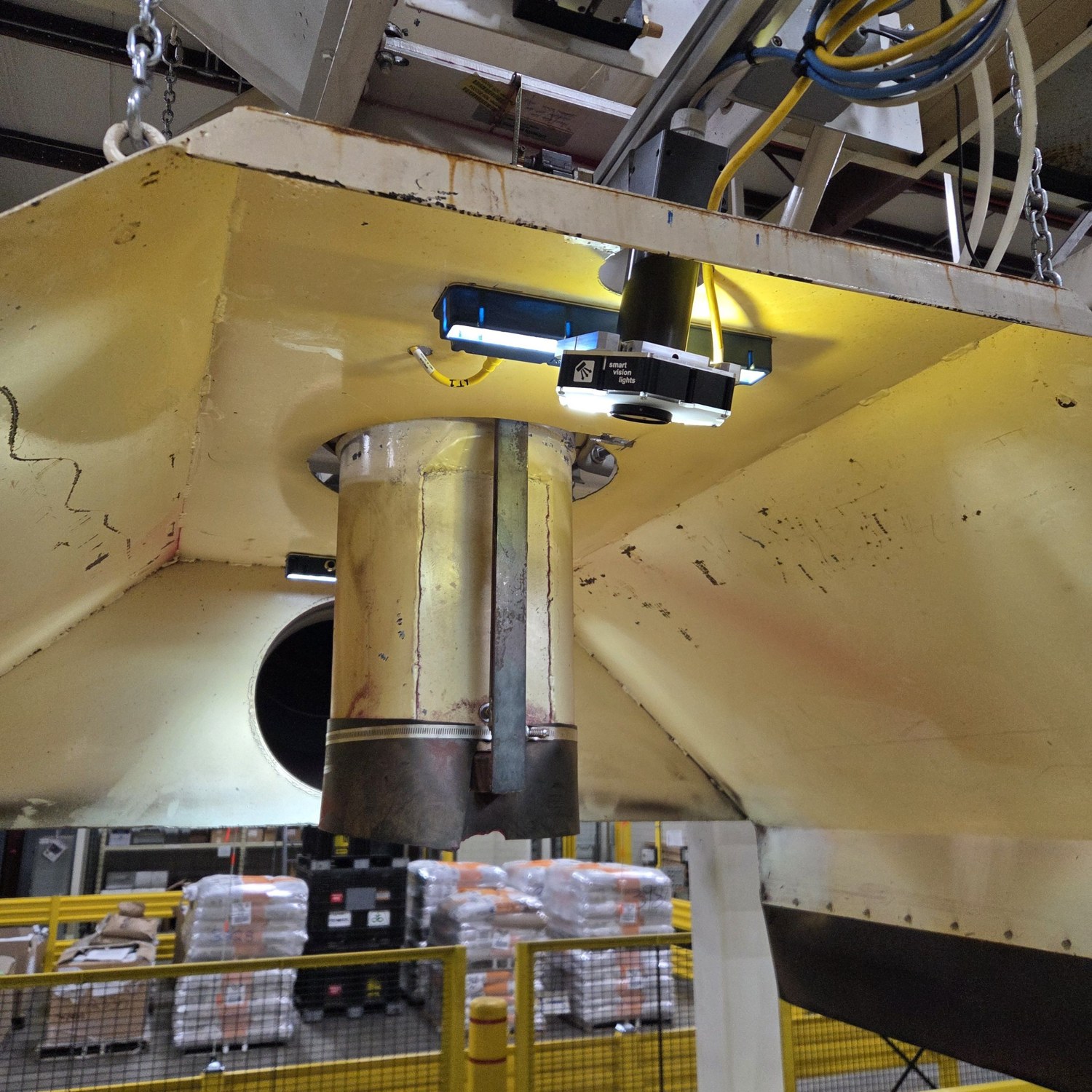 Camera and LED bar mounted beneath the fill hopper, looking down at the probox below